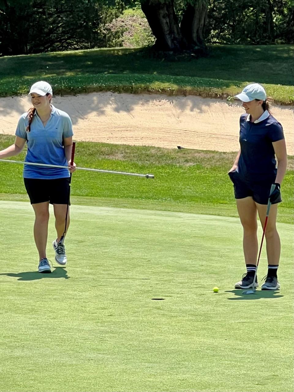 Cousins Maura Murphy, left, and Maddie Murphy enjoy a moment together on the ninth hold at Valley View Golf Course Monday during the final regular season tournament in the Heart of Ohio Junior Golf Association.