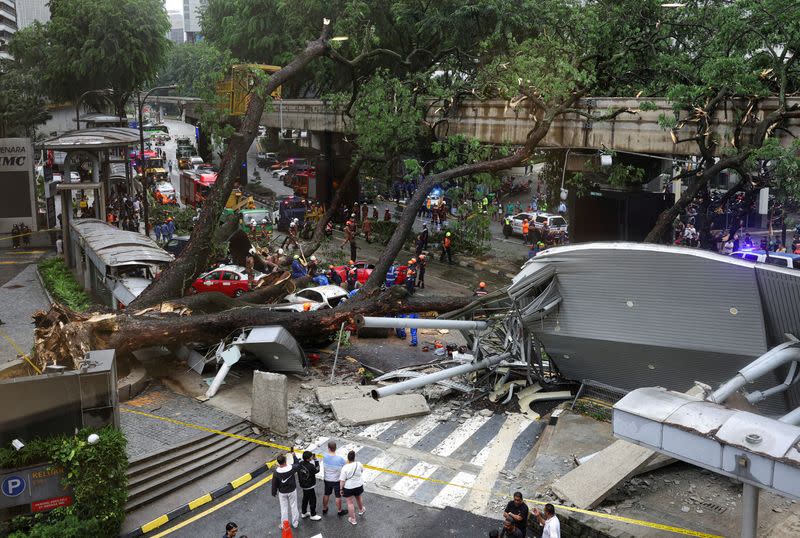 A tree fell across Jalan Raja Chulan, one of the Kuala Lumpur's busiest roads