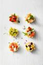 <p>This no-bake snack features tons of topping combo ideas for tortilla chip cups. So easy.</p><p>Get the <a href="https://www.goodhousekeeping.com/food-recipes/a35191279/stuffed-tortilla-cups-recipe/" rel="nofollow noopener" target="_blank" data-ylk="slk:Stuffed Tortilla Cups recipe;elm:context_link;itc:0;sec:content-canvas" class="link "><strong>Stuffed Tortilla Cups recipe</strong></a>.</p>