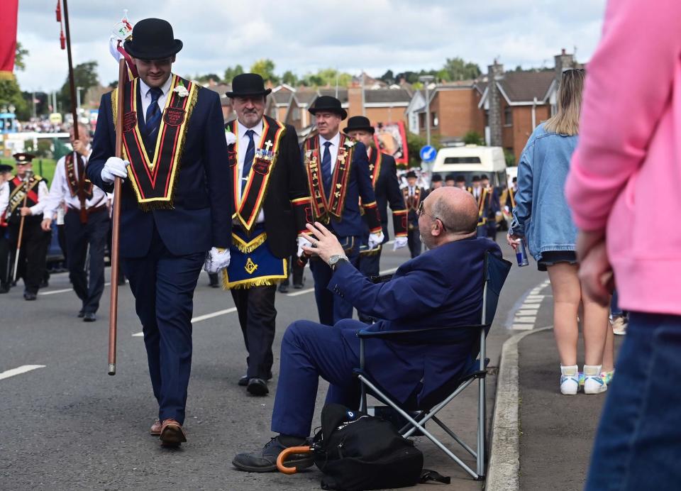 Enjoying a good view of the parade in Lisburn. (Photo: Colm Lenaghan/Pacemaker)