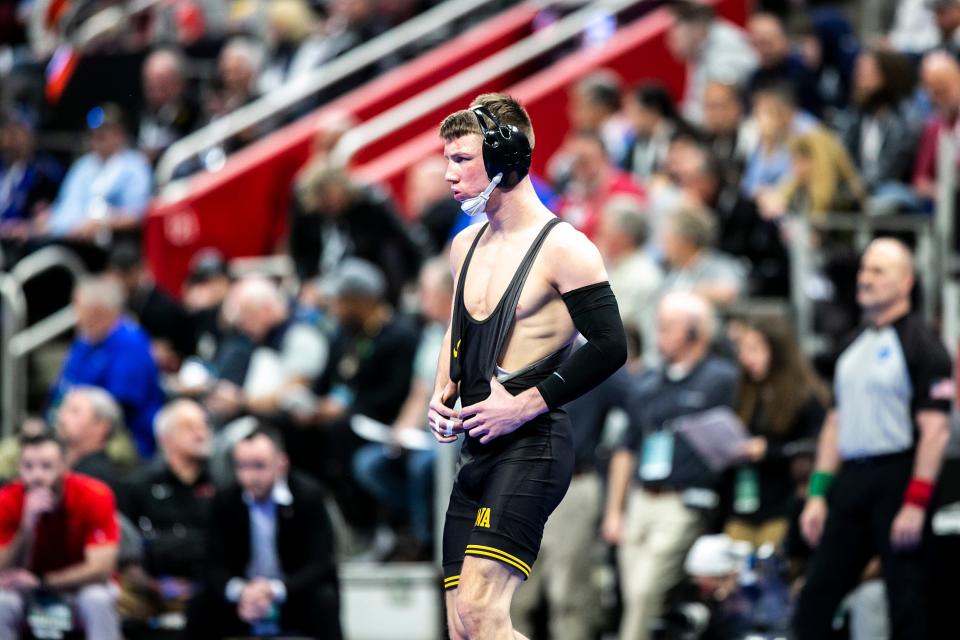 Iowa's Max Murin is introduced before wrestling at 149 pounds in the quarterfinals during the third session of the NCAA Division I Wrestling Championships, Friday, March 18, 2022, at Little Caesars Arena in Detroit, Mich.