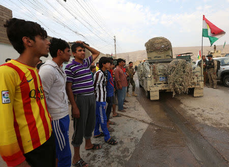 Kurdish Peshmerga vehilce drives through after recapturing from Islamic state militants the Fadiliya village in Nawaran, north of Mosul, Iraq, October 27, 2016. REUTERS/Ari Jalal