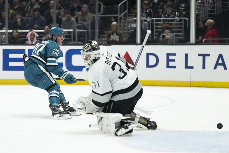 San Jose Sharks left wing Fabian Zetterlund (20) scores past Los Angeles Kings goaltender David Rittich (31) during the first period of an NHL hockey game Wednesday, Dec. 27, 2023, in Los Angeles. (AP Photo/Kyusung Gong)
