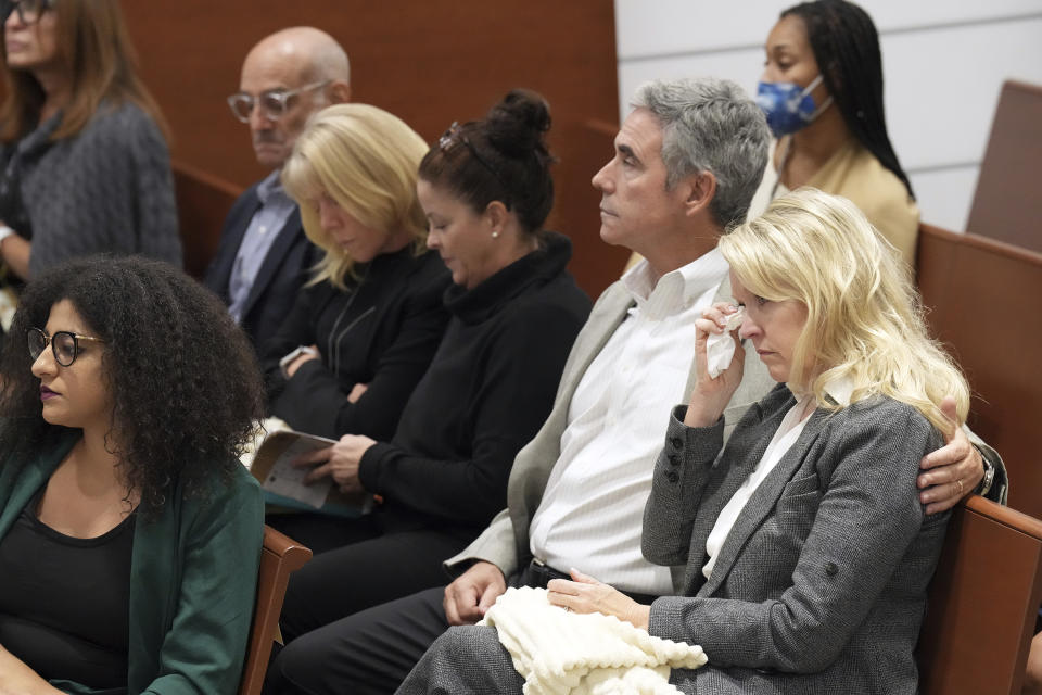 Gena and Tom Hoyer are shown in the courtroom gallery as video is played of Marjory Stoneman Douglas High School shooter Nikolas Cruz discussing how he planned the 2018 attacks. This during the penalty phase of the trial of Marjory Stoneman Douglas High School shooter Nikolas Cruz at the Broward County Courthouse in Fort Lauderdale on Monday, Oct. 3, 2022. The Hoyer's son, Luke, was killed in the shootings. Cruz previously plead guilty to all 17 counts of premeditated murder and 17 counts of attempted murder in the 2018 shootings. (Amy Beth Bennett/South Florida Sun Sentinel via AP, Pool)