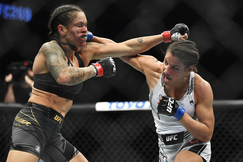 LAS VEGAS, NEVADA - DECEMBER 11: (R-L) Julianna Pena punches Amanda Nunes of Brazil in their UFC bantamweight championship bout during the UFC 269 on December 11, 2021 in Las Vegas, Nevada. (Photo by Chris Unger/Zuffa LLC)