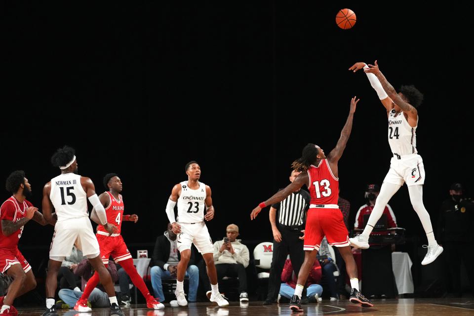 Cincinnati Bearcats guard Jeremiah Davenport (24) rises for a 3-point shot in the first half of an NCAA men's college basketball game against the Miami (Oh) Redhawks , Wednesday, Dec. 1, 2021, at Millett Hall in Oxford, Ohio.