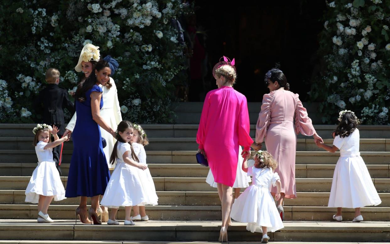 The Duchess of Cambridge took charge, leading the children into the chapel - PA
