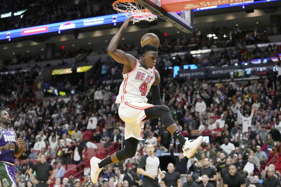 Miami Heat guard Victor Oladipo (4) dunks during the second half of an NBA basketball game against the Milwaukee Bucks, Saturday, Jan. 14, 2023, in Miami. Miami won 111-95. (AP Photo/Lynne Sladky)