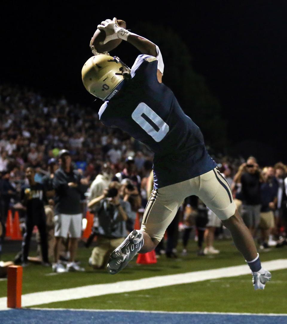 Hoban wide receiver Payton Cook catches a second-half touchdown pass against St. Ignatius on Sept. 16, 2022.