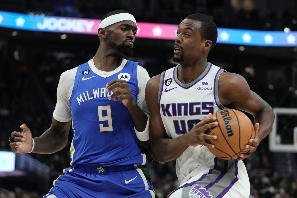 Sacramento Kings' Harrison Barnes drives by Milwaukee Bucks' Bobby Portis during the first half of an NBA basketball game Wednesday, Dec. 7, 2022, in Milwaukee. (AP Photo/Morry Gash)