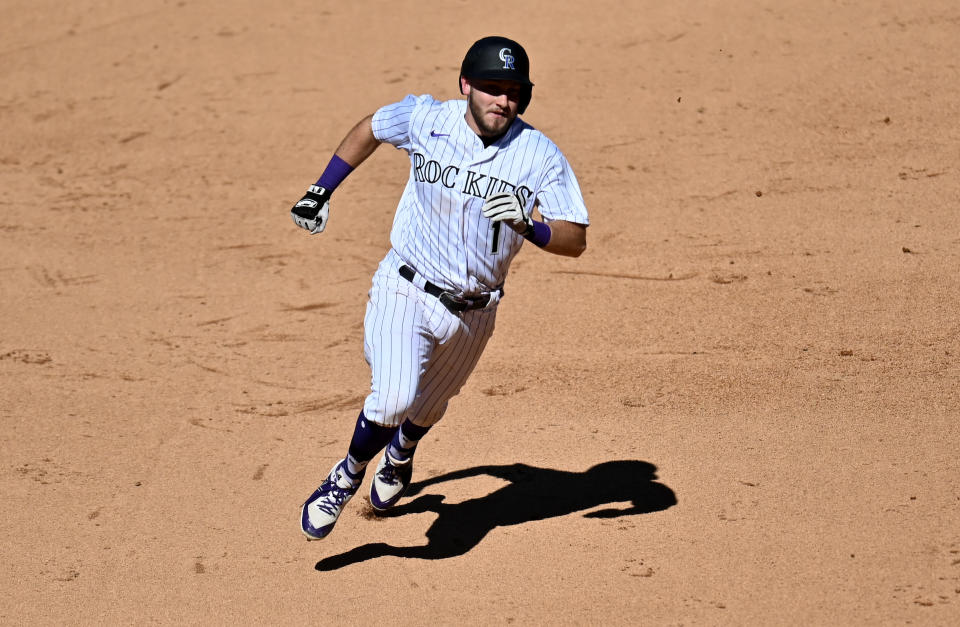 Sep 2, 2020; Denver, Colorado, USA; Colorado Rockies second baseman Garrett Hampson (1) heads home to score a run in the sixth inning against the San Francisco Giants at Coors Field. Mandatory Credit: Ron Chenoy-USA TODAY Sports