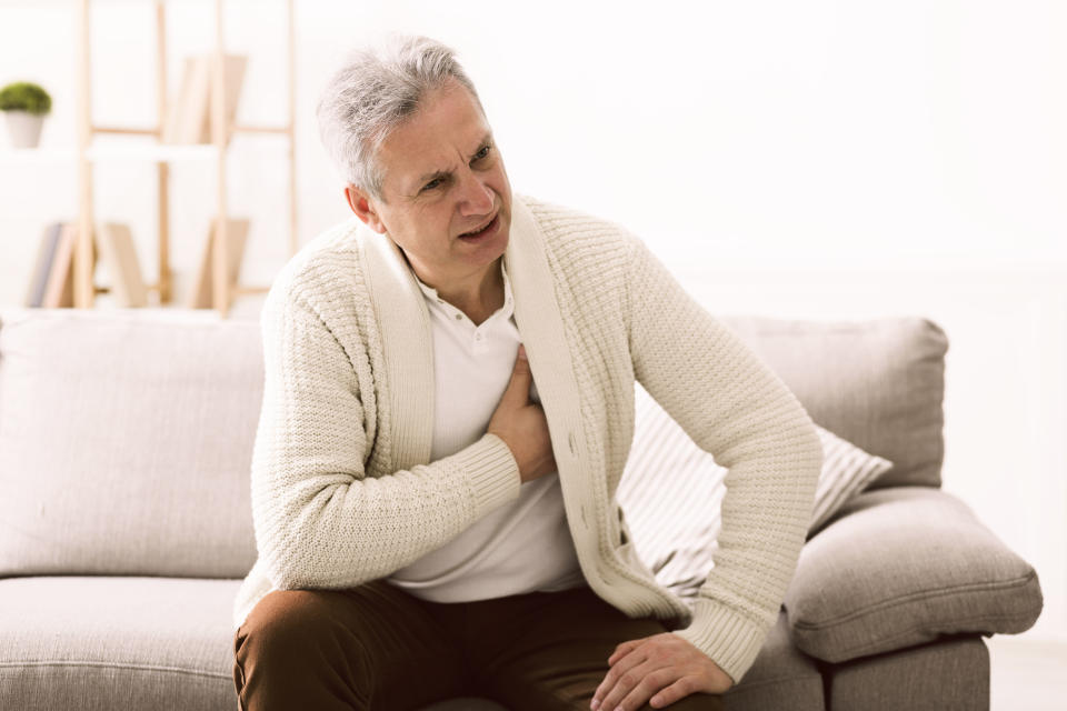 Man over 60 experiencing chest pain. (Image via Getty Images)