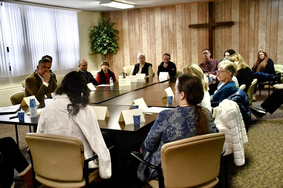 Many of the Ukranian refugees who spoke during a Thursday, Jan. 4 meeting with U.S. Sen. Martin Heinrich, left, in Farmington expressed concerns about their visa status.