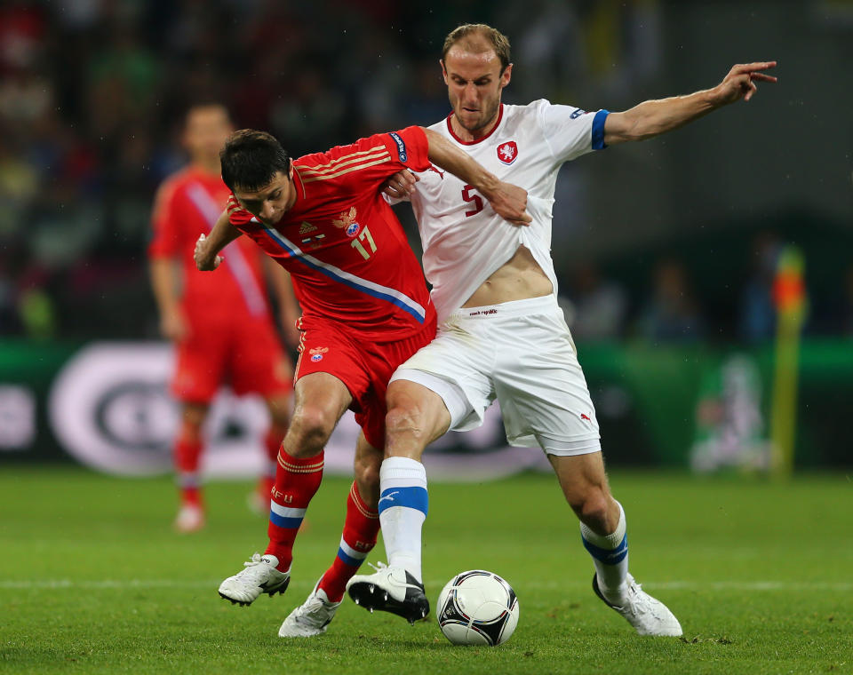 WROCLAW, POLAND - JUNE 08: Tomas Sivok of Czech Republic andAlan Dzagoev of Russia fight for the ball during the UEFA EURO 2012 group A match between Russia and Czech Republic at The Municipal Stadium on June 8, 2012 in Wroclaw, Poland. (Photo by Clive Mason/Getty Images)