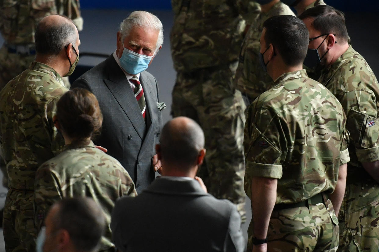 The Prince of Wales meets members of the RAF who helped during the mass testing for Covid-19 in South Wales, as part of his visit to the Engine House youth charity in Merthyr Tydfil, South Wales. Picture date: Friday May 14, 2021.