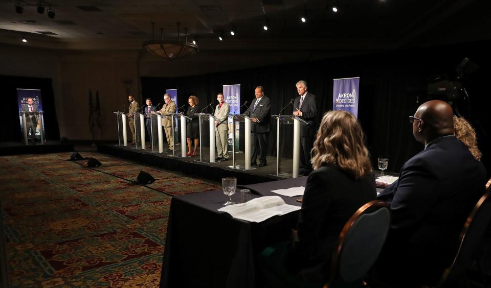 Candidates for mayor of Akron listen to questions from the media panel during the Akron Decides: Debating the Future mayoral debate.