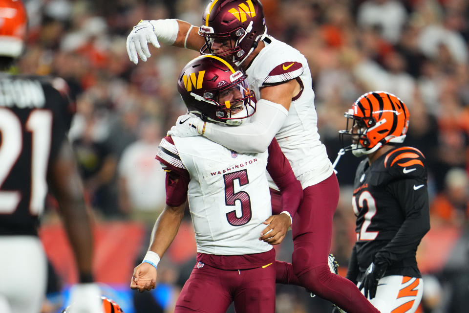 Jayden Daniels played a near-perfect game, leading the Commanders to an upset win and helping fantasy managers in Week 3. (Photo by Cooper Neill/Getty Images)