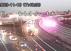 Lights from Columbus police vehicles can be seen on I-670 eastbound near 4th Street in the area where a shooting left one person in critical condition.