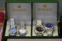 Fake Rolex watches are displayed at the U.S. Customs and Border Protection overseas mail inspection facility at Chicago's O'Hare International Airport Feb. 23, 2024, in Chicago. The explosive growth of cross-border e-commerce involving major China-backed players such as Shein and Temu has caught the attention of the U.S. lawmakers amid a bitter U.S.-China trade war and cast a spotlight on a tax rule that critics say has allowed hundreds of millions of China-originated packages to enter the U.S. market each year without duty and without reliable information for lawfulness. (AP Photo/Charles Rex Arbogast)
