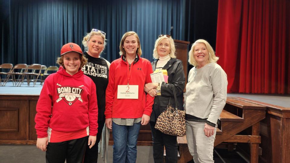 Second-place finisher Jensen Betzen, a seventh-grader from Randall Junior High School, stands with his family Saturday after the 2023 Regional Spelling Bee, held at Tascosa High School in Amarillo.