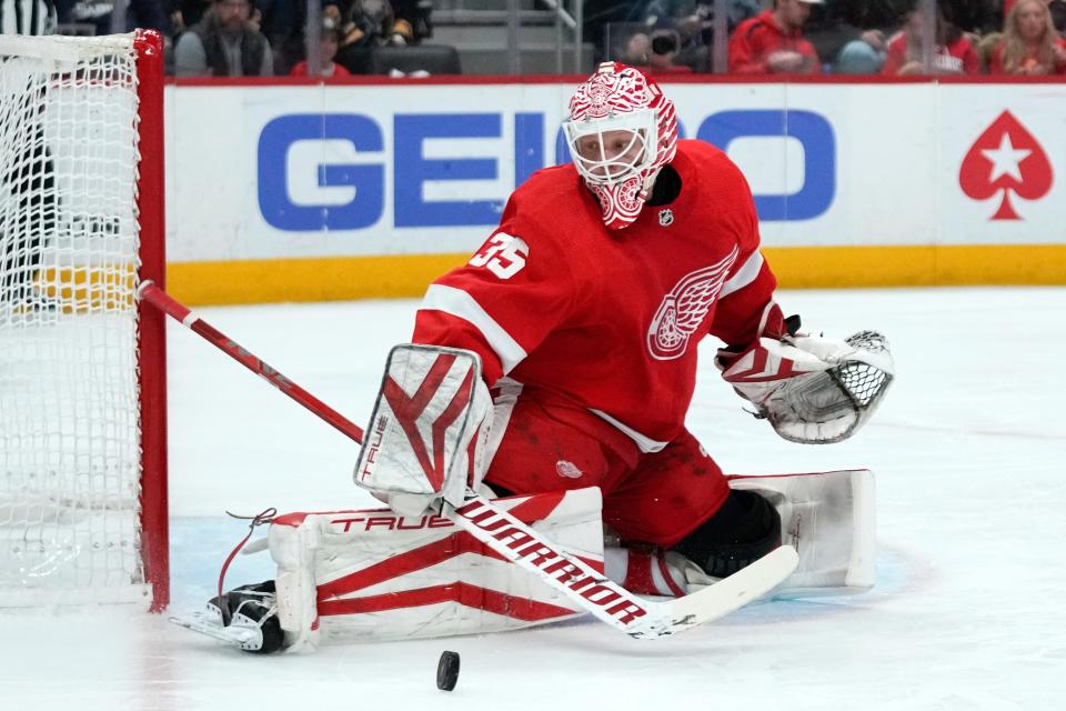 Detroit Red Wings goaltender Ville Husso (35) stops a Buffalo Sabres shot in the first period at Little Caesars Arena in Detroit on Thursday, April 6, 2023.