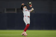 Cincinnati Reds second baseman Jonathan India makes a catch for the out on San Diego Padres' Ha-Seong Kim during the fourth inning of a baseball game, Tuesday, April 30, 2024, in San Diego. (AP Photo/Gregory Bull)