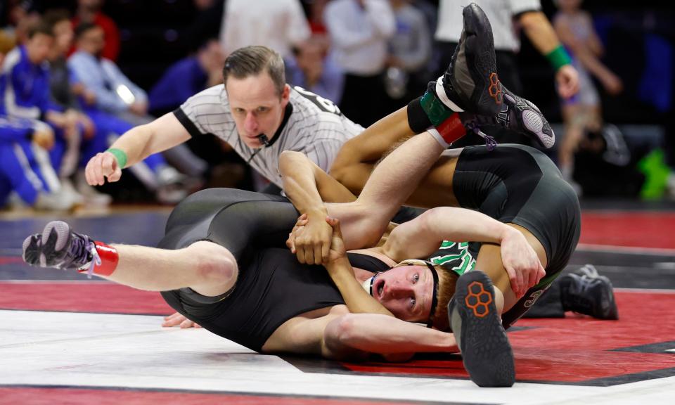 Camden Catholic's Kage Jones (right) has St. John Vianney's Patrick O'Keefe on his back during his 14-4 win in the 132-pound bout. Camden Catholic won the match 33-29.