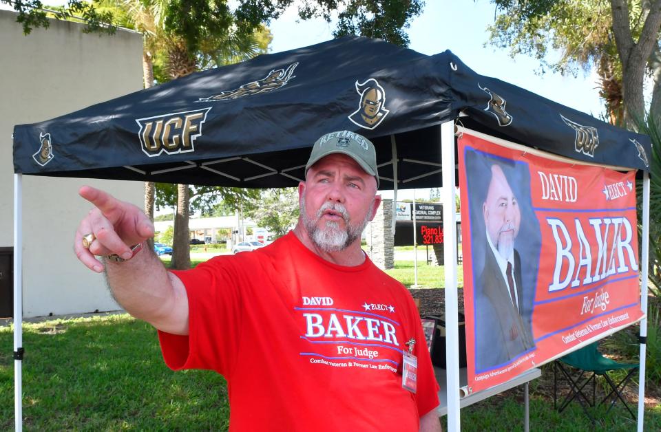 David Baker, running for county court judge, Group 2, was set up at the Veterans Memorial Complex in West Melbourne.