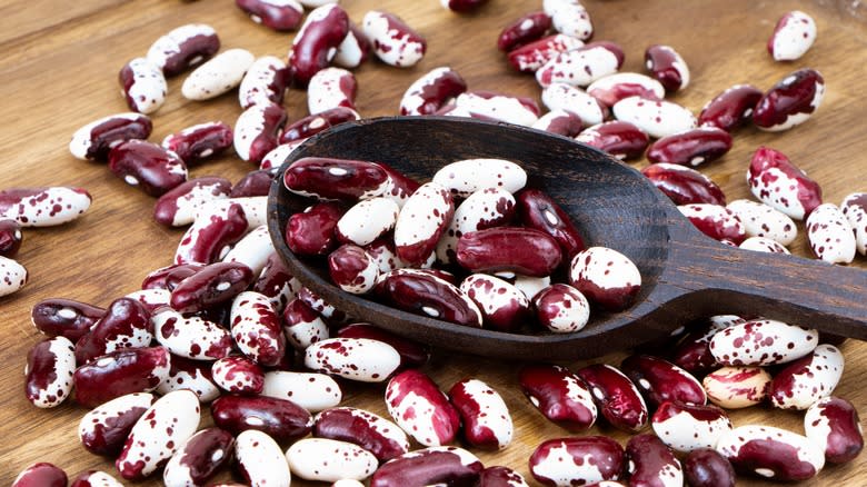 Purple and white beans on table