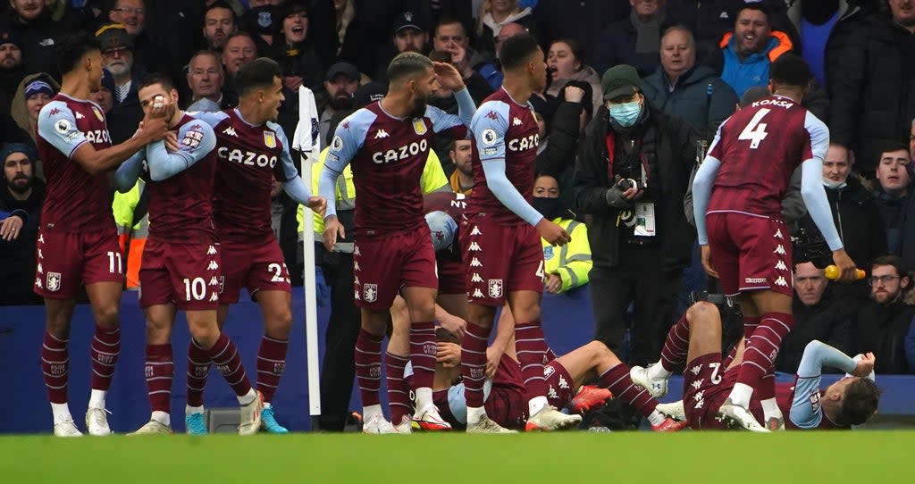 Aston Villa’s Lucas Digne and Matty Cash react to a missile being thrown during a Premier League match at Goodison Park (PA) (PA Wire)