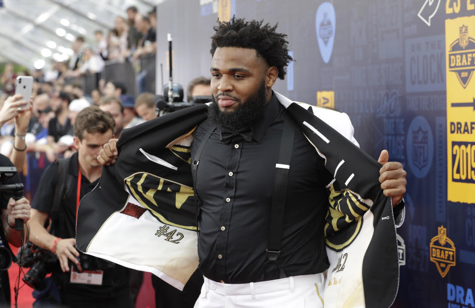 Clemson defensive tackle Christian Wilkins walks the red carpet ahead of the first round at the NFL football draft, Thursday, April 25, 2019, in Nashville, Tenn. (AP Photo/Steve Helber)