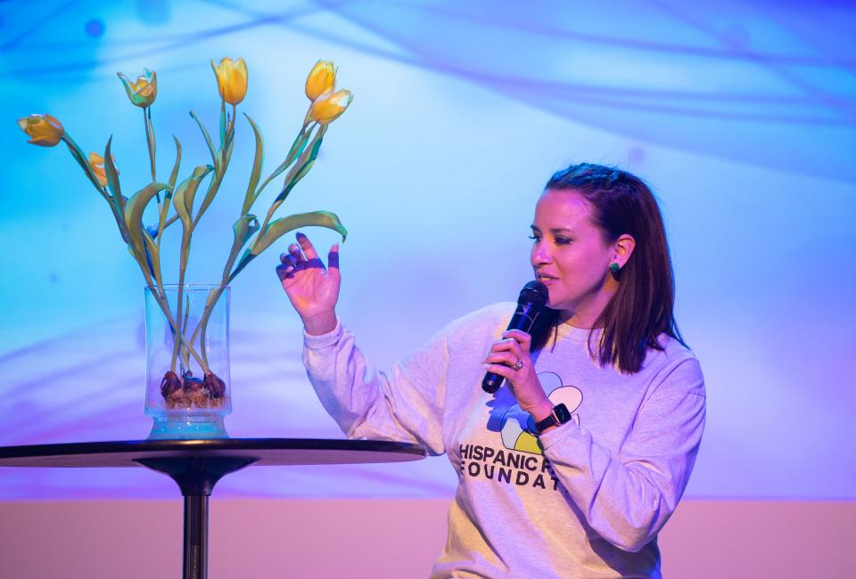 Diane Janbakhsh talks about the tulips and the symbolism behind them, representing those who lost their family and friends to the March 2021 flood on the Day of Remembrance event at Plaza Mariachi in the Xenote event room in Nashville, Tenn., Saturday, March 26, 2022.