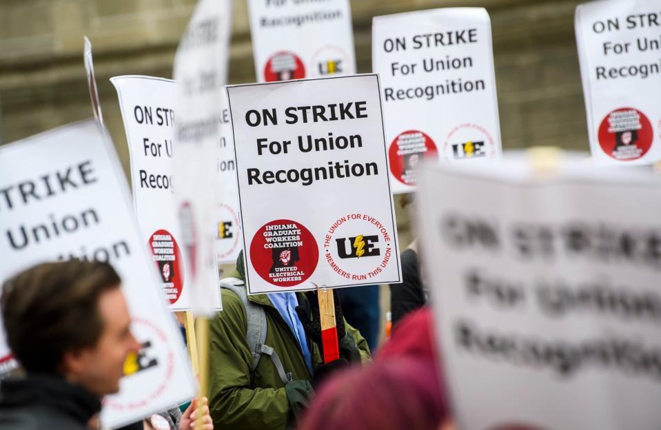 Picketers demonstrate support of the graduate workers strike at the Sample Gates on April 20, 2022.