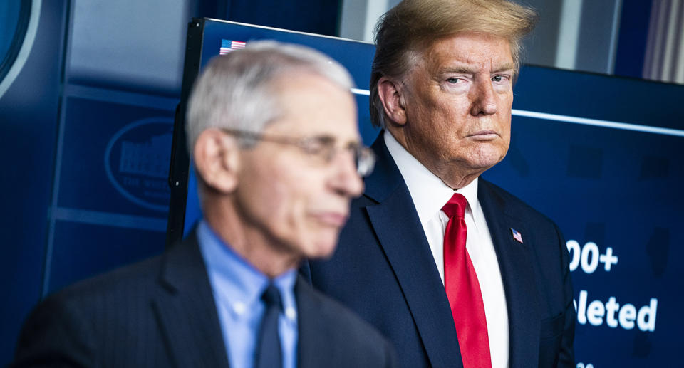 President Donald J. Trump listens to Dr. Anthony Fauci, director of the National Institute of Allergy and Infectious Diseases, speak with members of the coronavirus task force during a briefing in response to the COVID-19 coronavirus pandemic.