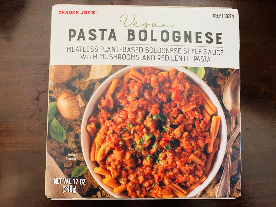 Original package of trader joe's vegan pasta bolognese on wood table