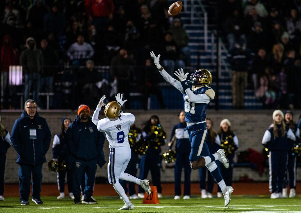 Newburgh's Deondre Johnson leaps to catch the ball during the NYSPHSAA Class AA semifinall football game in Middletown, NY on Saturday, November 26, 2022. Newburgh defeated Christian Brothers Academy. KELLY MARSH/FOR THE TIMES HERALD-RECORD