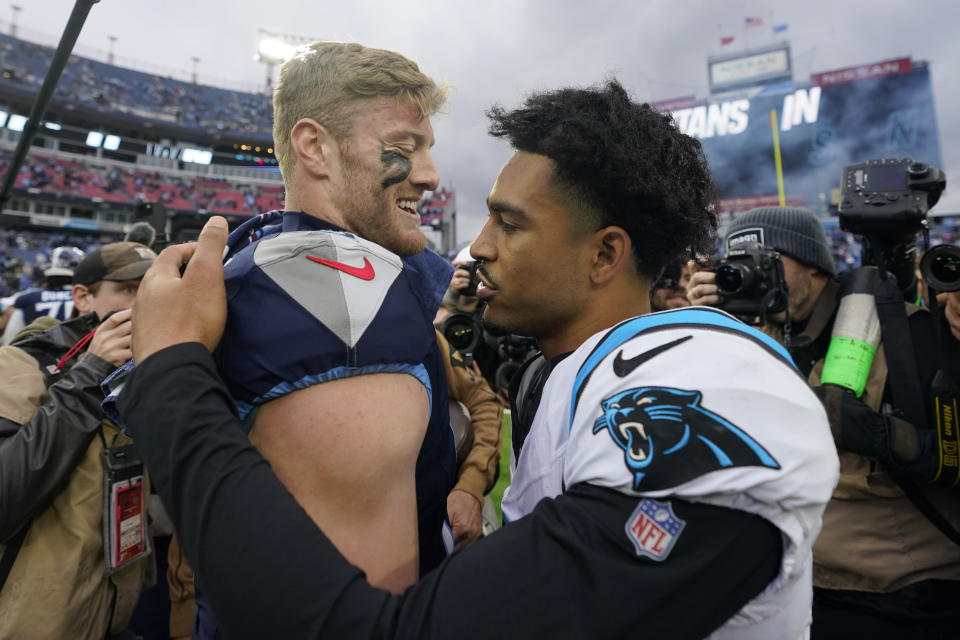 Tennessee Titans quarterback Will Levis, left, is congratulated by Carolina Panthers quarterback Bryce Young, right, after an NFL football game Sunday, Nov. 26, 2023, in Nashville, Tenn. The Titans won 17-10. (AP Photo/George Walker IV)