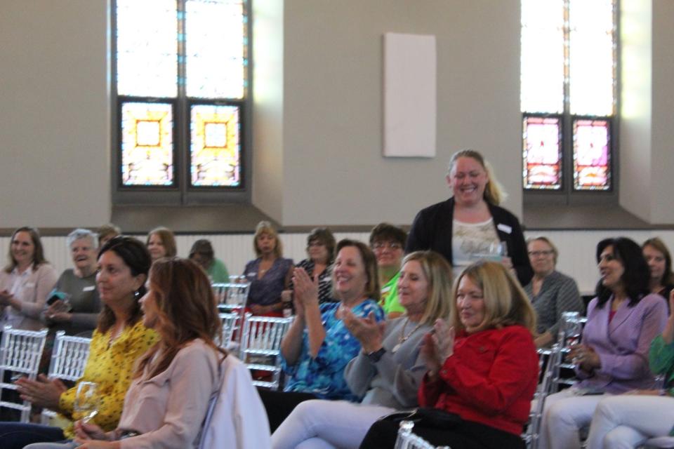 Members attend a Manitowoc County 100+ Women Who Care meeting at Sepia Chapel in Two Rivers in 2021.