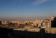 A general view picture shows the Israeli barrier running along the Shuafat refugee camp in East Jerusalem, in an area Israel annexed to Jerusalem after capturing it in the 1967 Middle East war