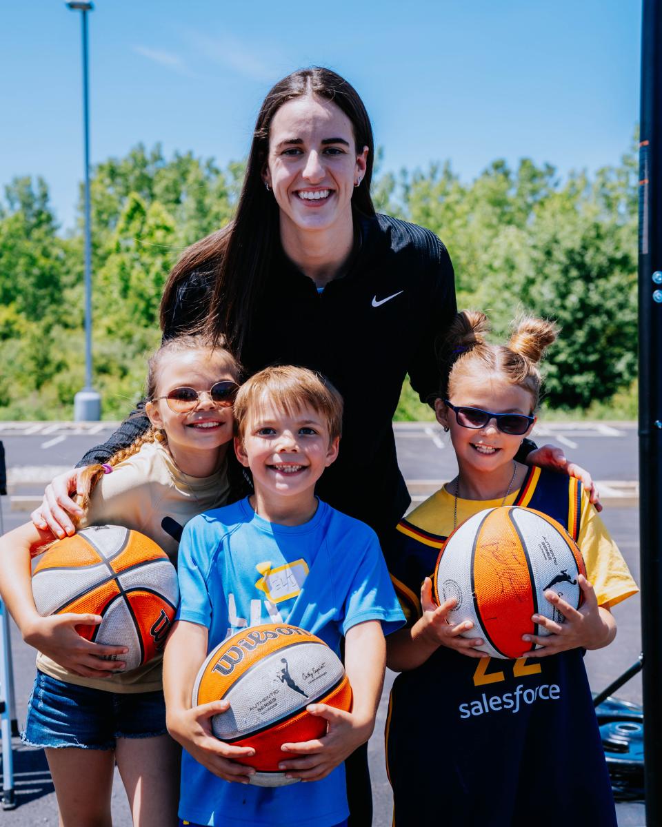 Indiana Fever's Caitlin Clark with Eli (middle) and his sisters, AVa (left) and Megan (right)