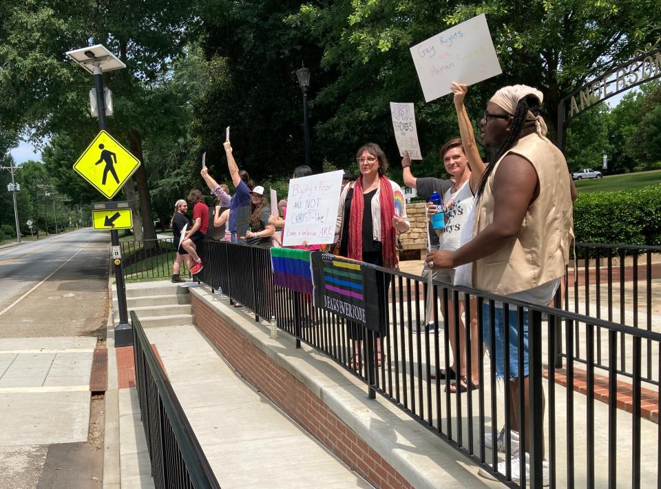 Former Anderson University professor Miranda Barnett, second from right, stands with protesters on Sunday morning after her contracts weren't renewed for the fall semester.