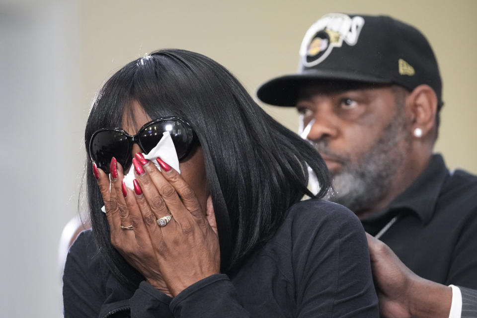 RowVaughn Wells, mother of Tyre Nichols, who died after being beaten by Memphis police officers, cries as she is comforted by Tyre's stepfather Rodney Wells, at a news conference with civil rights Attorney Ben Crump in Memphis, Tenn., Monday, Jan. 23, 2023. (AP Photo/Gerald Herbert)