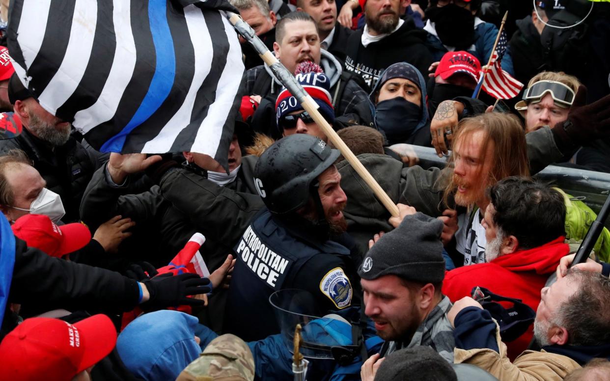 Officer Michael Fanone was dragged into the crowd - SHANNON STAPLETON /Reuters 