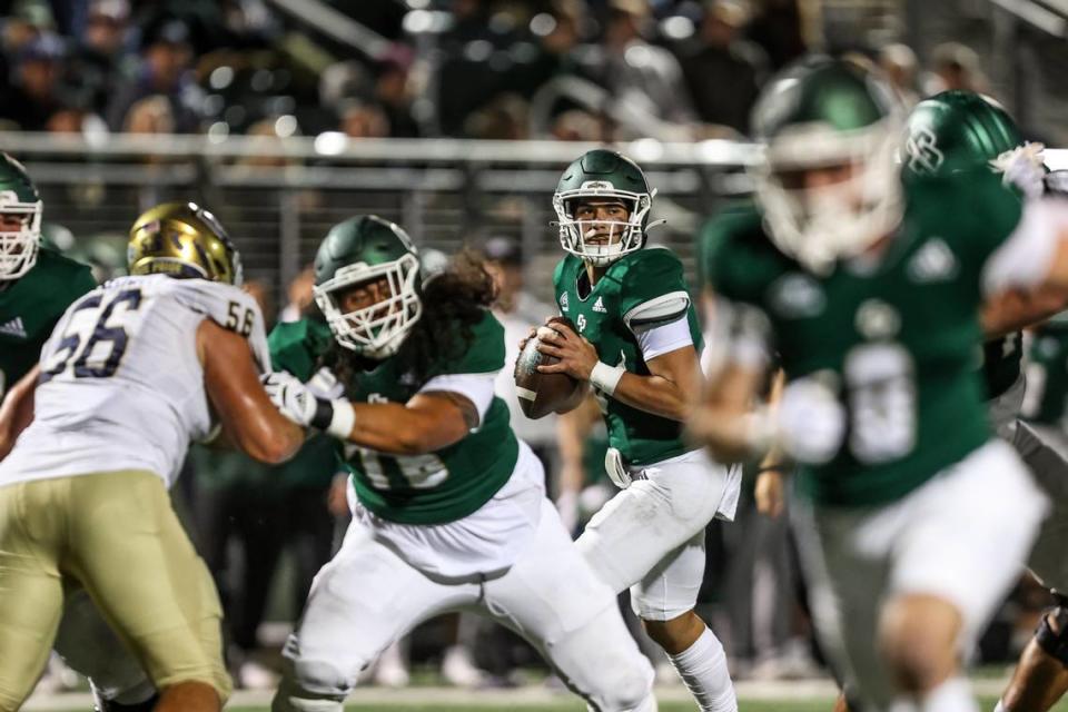 Cal Poly quarterback Bo Kelly (3) drops back for a pass during the Mustangs’ 31-13 loss to UC Davis on Sept. 30, 2023, at Spanos Stadium.