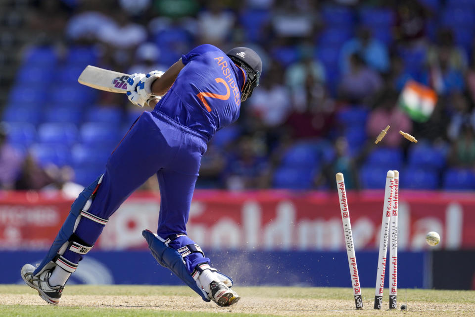 India's Aves Khan is bowled by West Indies' Jason Holder during the second T20 cricket match at Warner Park in Basseterre, St. Kitts and Nevis, Monday, Aug. 1, 2022. (AP Photo/Ricardo Mazalan)