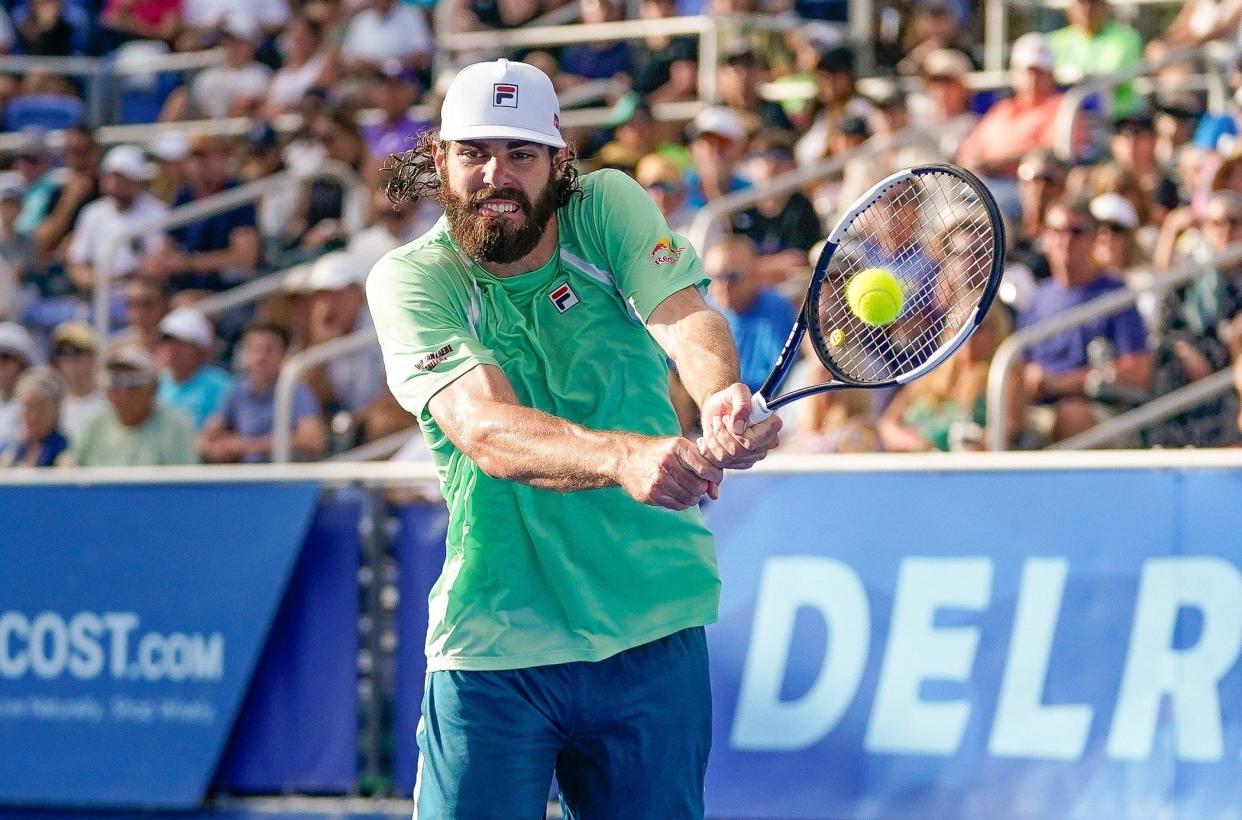 Reilly Opelka returns a volley during his loss to Cameron Norrie in the finals of the Delray Beach Open at the Delray Beach Stadium and Tennis Center in 2022.