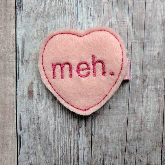 Get it <a href="https://www.etsy.com/listing/570787980/meh-heart-clip-pink-embroidered-acrylic?ga_order=most_relevant&amp;ga_search_type=all&amp;ga_view_type=gallery&amp;ga_search_query=valentine%27s%20day%20anti&amp;ref=sr_gallery-8-29" target="_blank">here</a>.&nbsp;