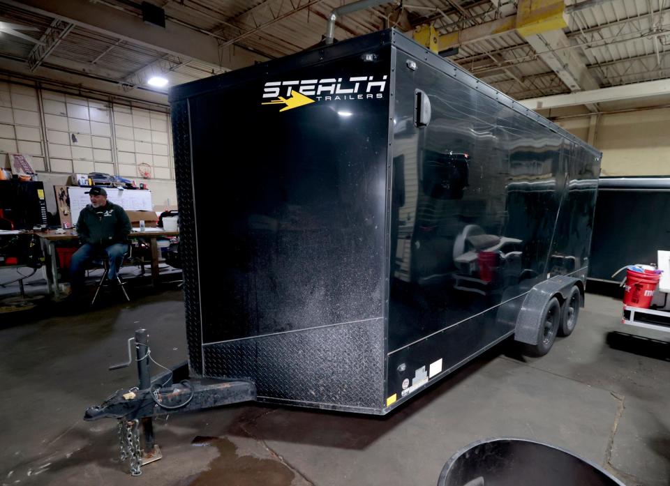 A recovered trailer is safely parked inside the Fowling Warehouse in Hamtramck on Friday, Dec. 1, 2023. The trailer, owned by Scott Brown, 62, manager and co-owner of the Fowling Warehouse in Ypsilanti, had the logos of his fowling business stripped from the sides of the trailer, along with bowling pins, wood gaming platforms and other items that weren't recovered but he's happy his $10,000 trailer was found intact.