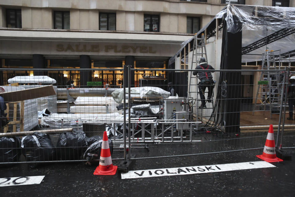 A graffiti in front of the venue of the Cesar Awards ceremony reads "Violanski", playing with the French word for rape and the name of Roman Polanski, Thursday, Feb. 27, 2020 in Paris. French women's rights activists are plastering banners to protest multiple nominations for Roman Polanski at the Cesar Awards ceremony, France's equivalent of the Oscars. This year's Cesars have been shaken by boycott calls since the nominations for Polanski's "An Officer and a Spy," because a French woman recently accused Polanski of raping her in the 1970s, which he denies. (AP Photo/Thibault Camus)