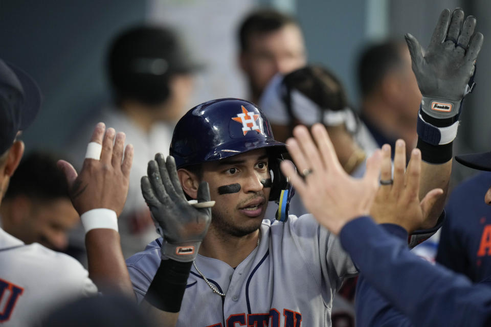 Houston Astros' Mauricio Dubon, center, celebrates his home against the Los Angeles Dodgers during the fourth inning of a baseball game Friday, June 23, 2023, in Los Angeles. (AP Photo/Jae C. Hong)